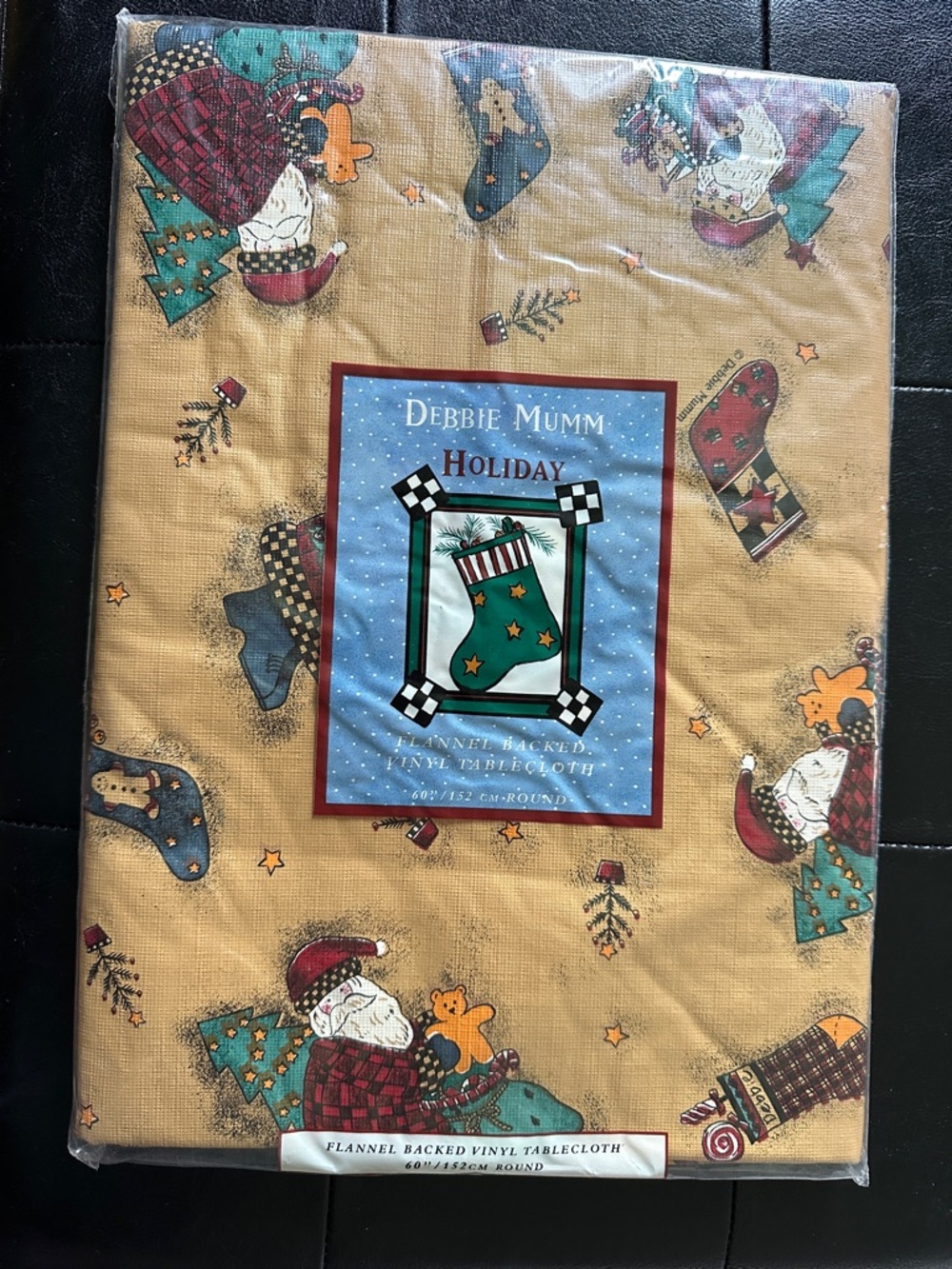 Debbie Mumm Vintage Magic of Santa Round 60” Flannel-Backed Vinyl Tablecloth